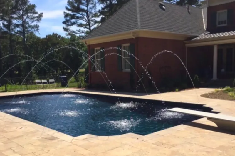 Rectangle pool with water jet fountains.