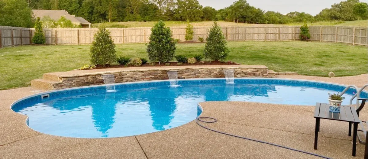 This is a lagoon style pool design featuring a natural stone waterfall.