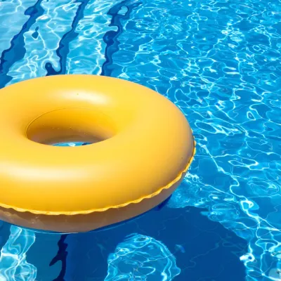 Yellow round donut float for swimming pool.